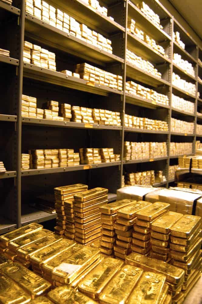 Gold bars stacked in vault